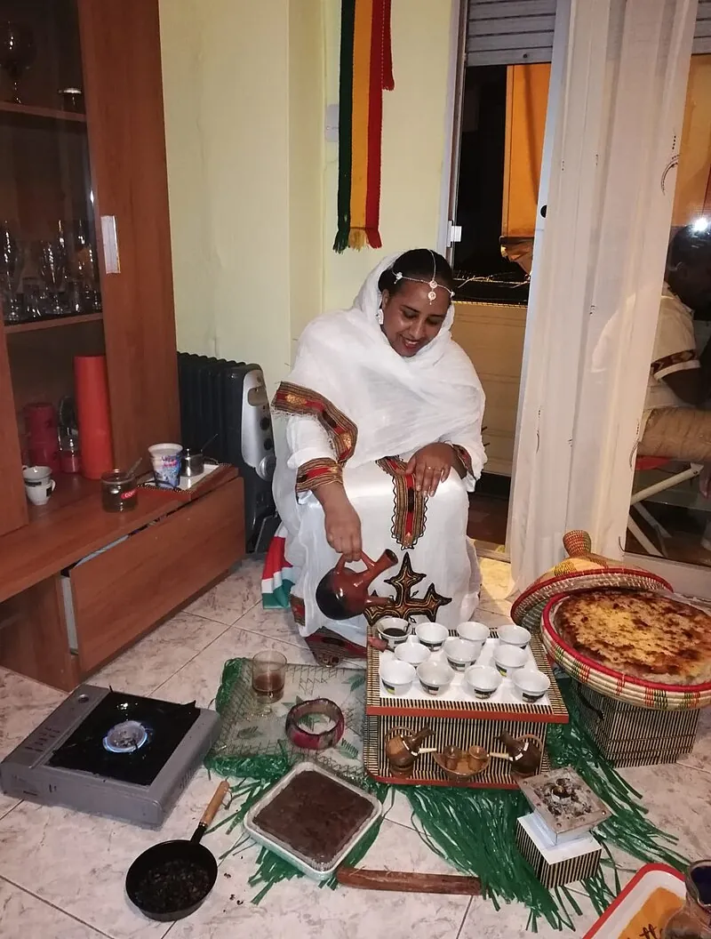 Traditional Ethiopian coffee ceremony with clay jebena pot